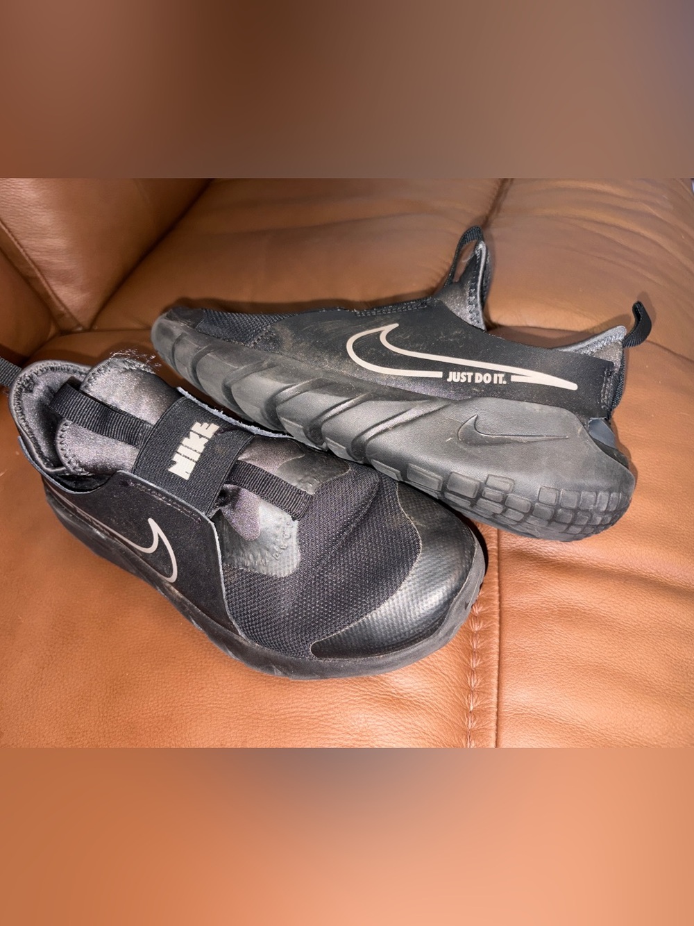 Nike Black Slip-On Sneakers with White Swoosh and 'Just Do It.' Accent